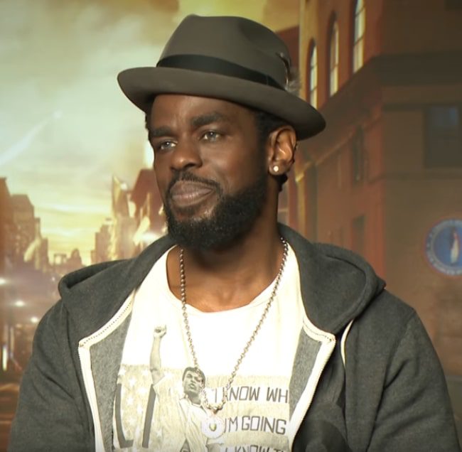 mustafa-shakir-during-an-interview-for-mtv-regarding-season-2-of-luke-cage-in-2018 Mustafa Shakir during an interview for MTV regarding season 2 of 'Luke Cage' in 2018