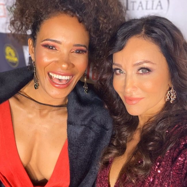 sofia-milos-right-smiling-in-a-selfie-alongside-denny-mendez-at-tcl-chinese-theatre-in-los-angeles-california-in-february-2020 Sofia Milos (Right) smiling in a selfie alongside Denny Mendez at TCL Chinese Theatre in Los Angeles, California in February 2020
